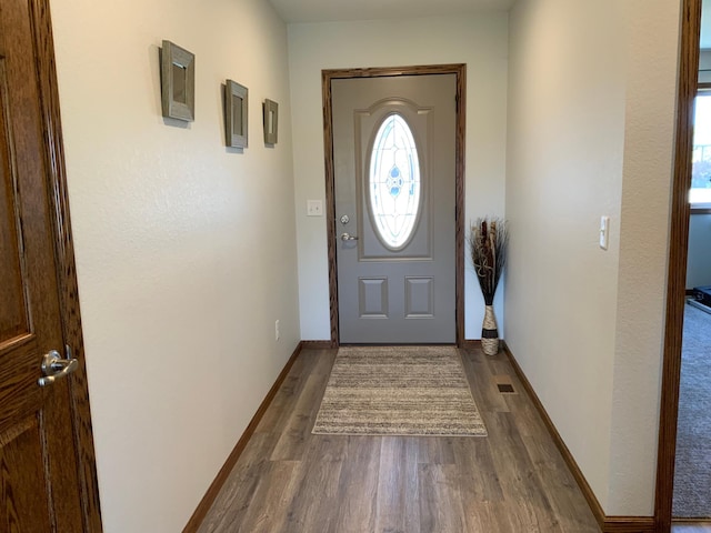 doorway to outside with hardwood / wood-style floors