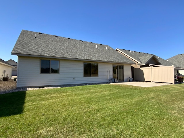 back of house featuring cooling unit, a yard, and a patio area