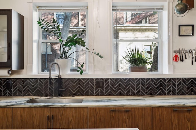 1920 Pillsbury Ave S, Minneapolis, MN 55403 - bathroom with a sink, tasteful backsplash, and plenty of natural light