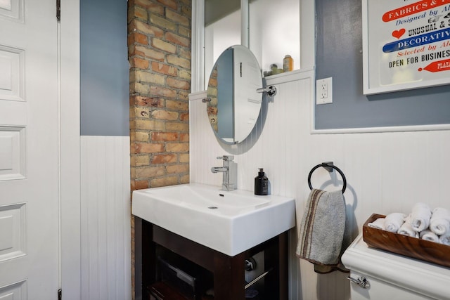 1920 Pillsbury Ave S, Minneapolis, MN 55403 - bathroom featuring a wainscoted wall, vanity, and toilet