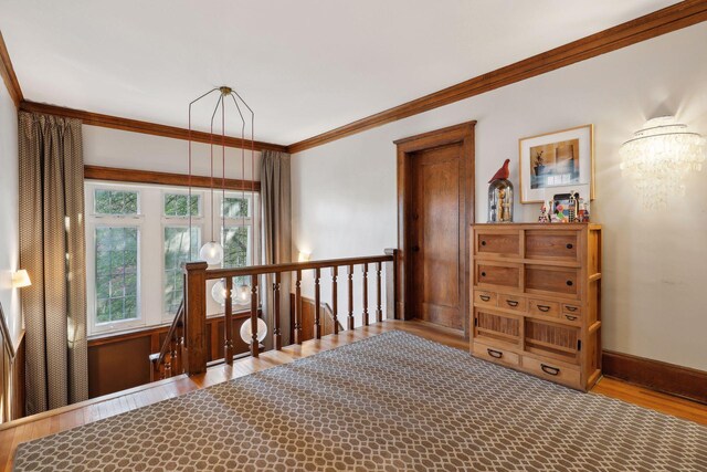 1920 Pillsbury Ave S, Minneapolis, MN 55403 - bedroom with ornamental molding, wood finished floors, a chandelier, and baseboards
