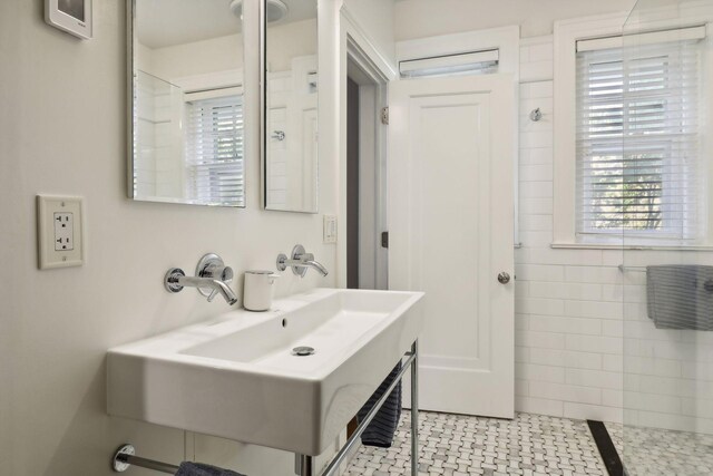 1920 Pillsbury Ave S, Minneapolis, MN 55403 - bathroom with healthy amount of natural light, a sink, and tiled shower
