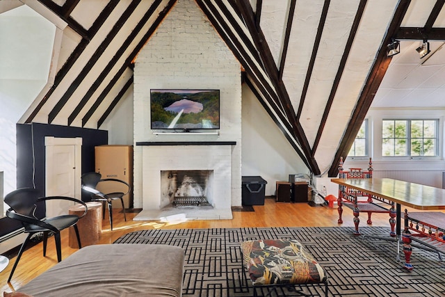 1920 Pillsbury Ave S, Minneapolis, MN 55403 - living area with a fireplace, wood finished floors, beamed ceiling, and high vaulted ceiling