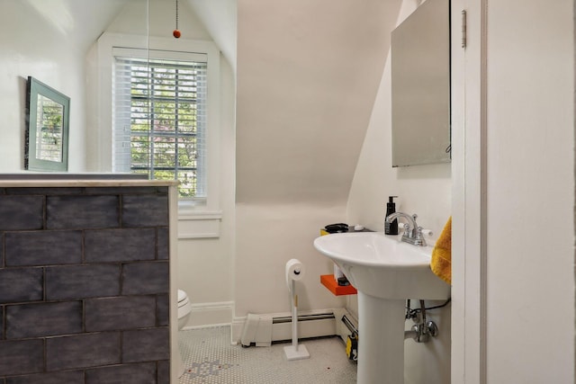 1920 Pillsbury Ave S, Minneapolis, MN 55403 - bathroom featuring baseboard heating, toilet, tile patterned floors, and baseboards