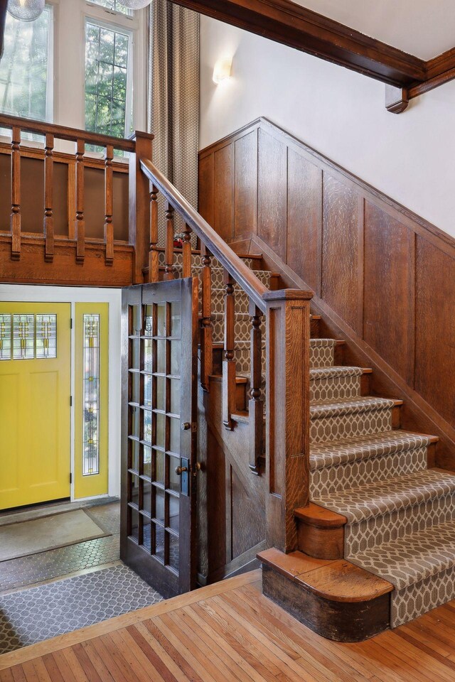 1920 Pillsbury Ave S, Minneapolis, MN 55403 - stairway with wood-type flooring and a wainscoted wall