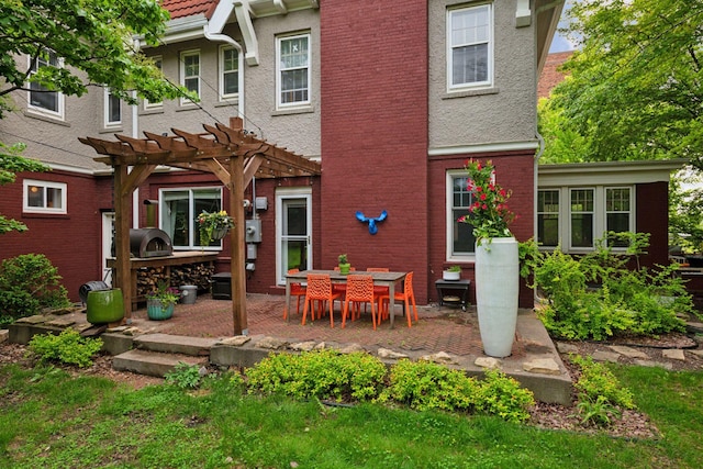 1920 Pillsbury Ave S, Minneapolis, MN 55403 - rear view of house with a patio area, a pergola, and brick siding