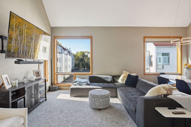 carpeted living room with vaulted ceiling