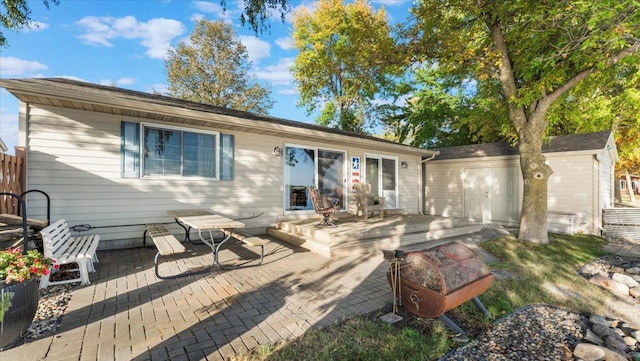 8737 123rd Ave SE, Lake Lillian, MN 56253 - rear view of property featuring a wooden deck and an attached garage