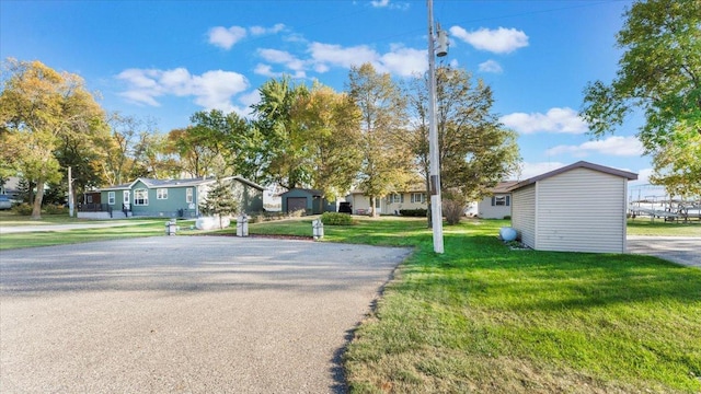 8737 123rd Ave SE, Lake Lillian, MN 56253 - view of asphalt road featuring a residential view