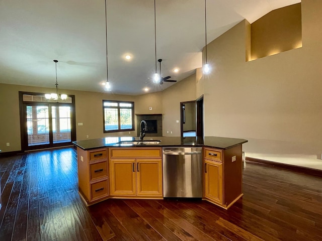 kitchen featuring stainless steel dishwasher, sink, an island with sink, and dark hardwood / wood-style flooring