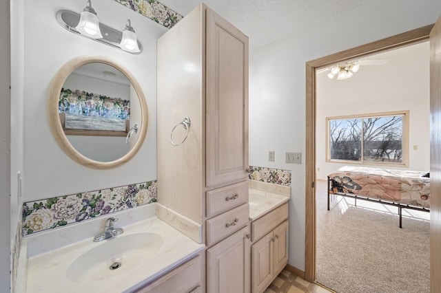 bathroom with vanity and a textured ceiling