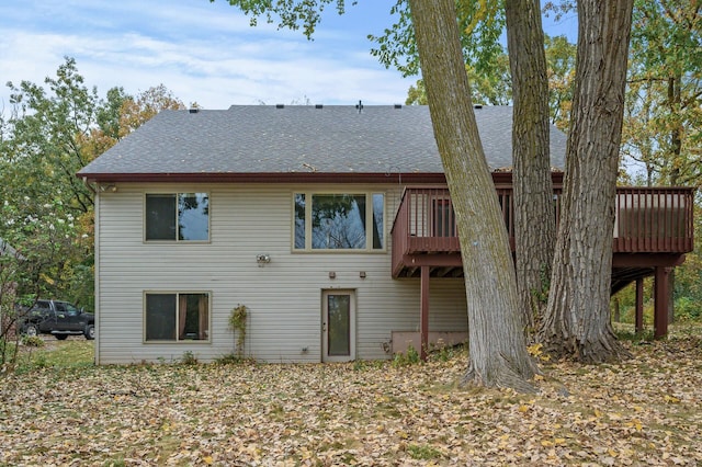 back of house with a wooden deck