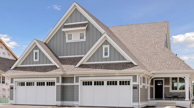 craftsman-style home featuring a garage and a porch