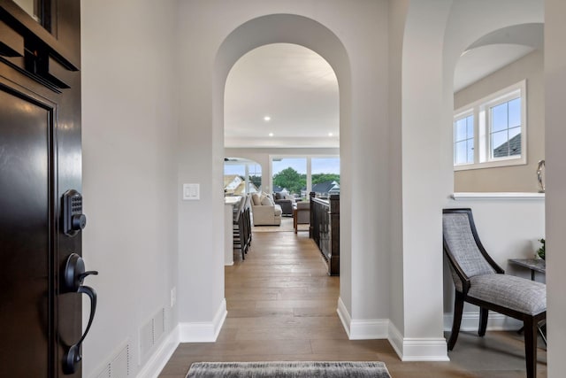 hallway featuring hardwood / wood-style flooring