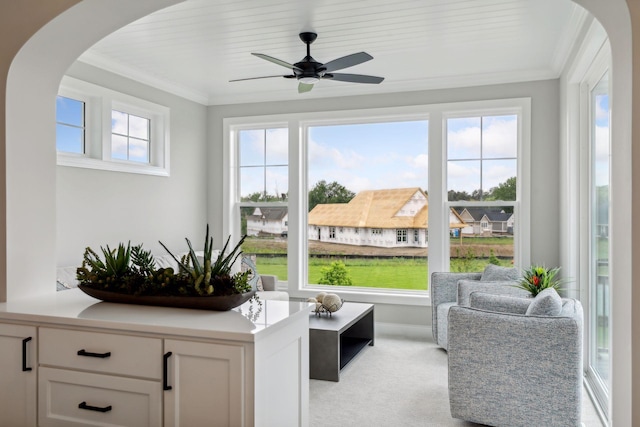 sunroom featuring ceiling fan and wooden ceiling