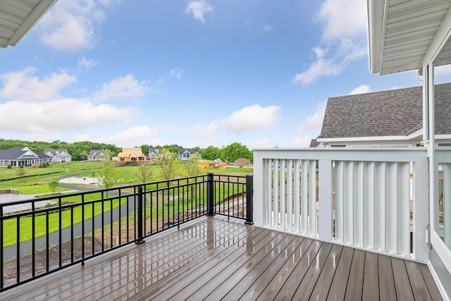 wooden deck with a lawn