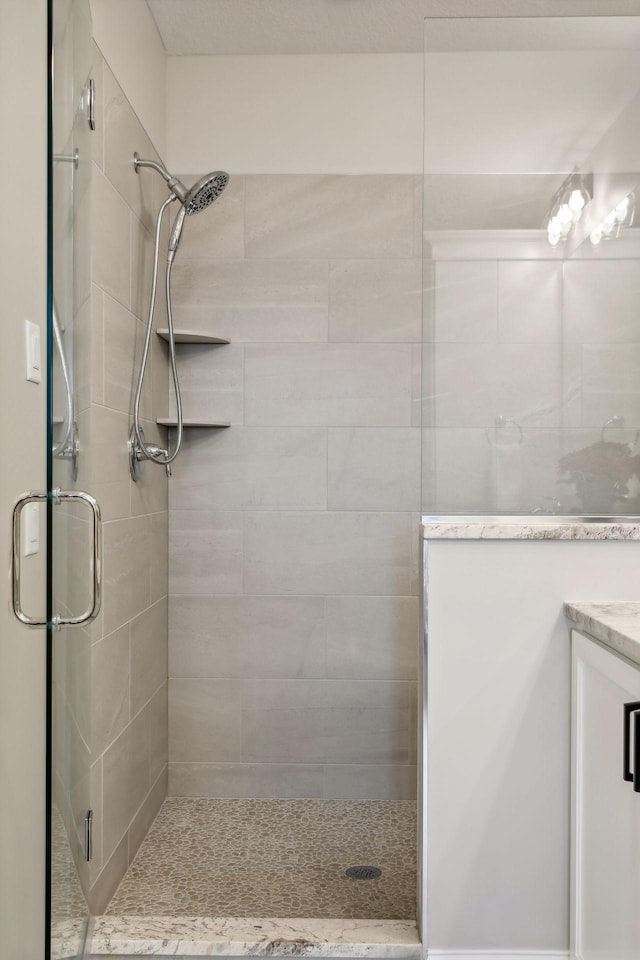 bathroom with vanity and walk in shower