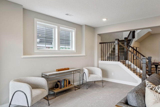 living area featuring carpet flooring