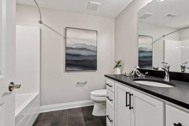 full bathroom with toilet, vanity, shower / washtub combination, and a textured ceiling