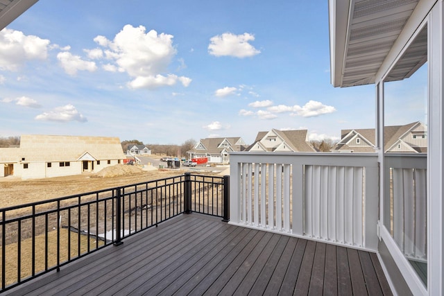 wooden terrace with a residential view