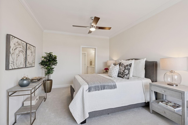 bedroom with baseboards, ensuite bath, carpet flooring, and crown molding