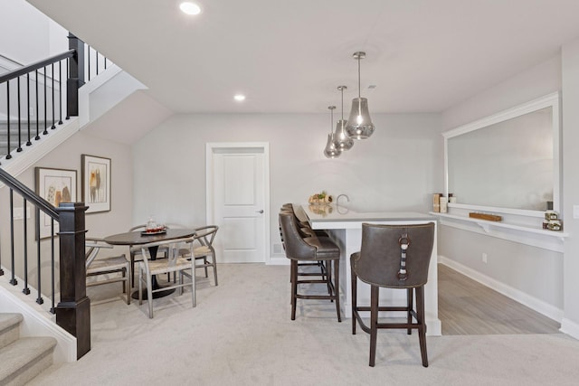 dining room with light carpet, stairway, recessed lighting, and baseboards