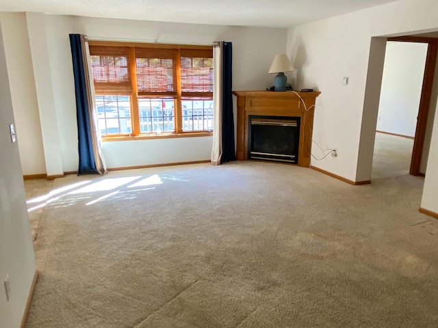 unfurnished living room featuring light carpet