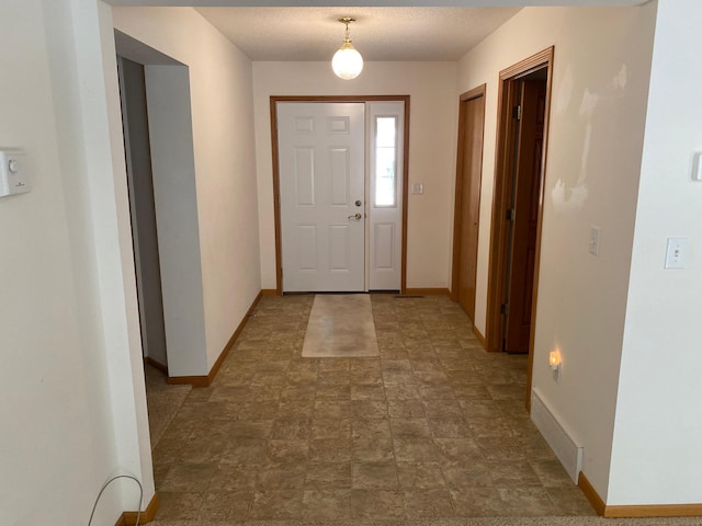 entrance foyer with a textured ceiling