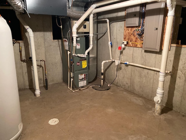 utility room with heating unit, electric panel, and water heater