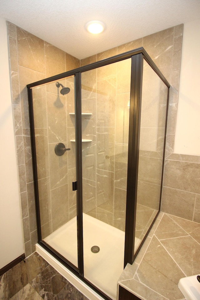 bathroom featuring an enclosed shower