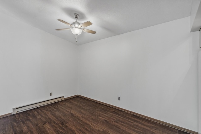 spare room featuring a textured ceiling, a baseboard heating unit, dark hardwood / wood-style flooring, and ceiling fan