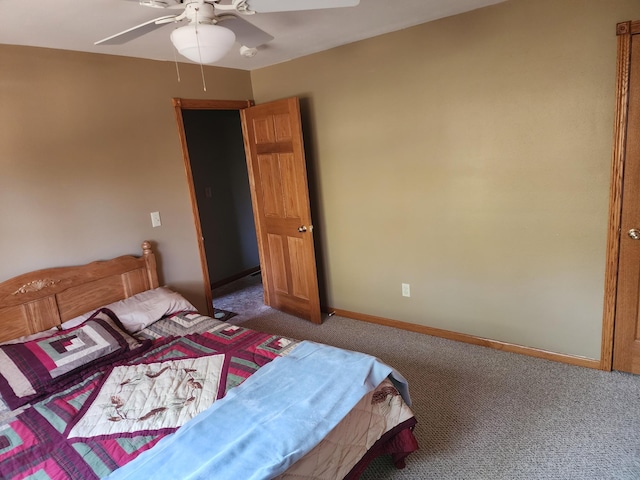 carpeted bedroom featuring a ceiling fan and baseboards