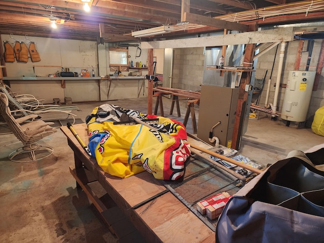 unfinished basement featuring water heater and heating unit