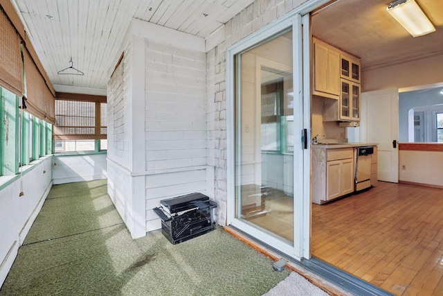 interior space featuring sink and wooden ceiling