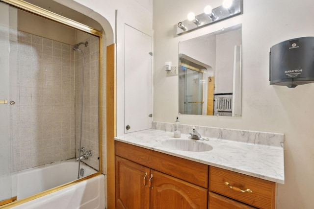 bathroom featuring vanity and tiled shower / bath combo