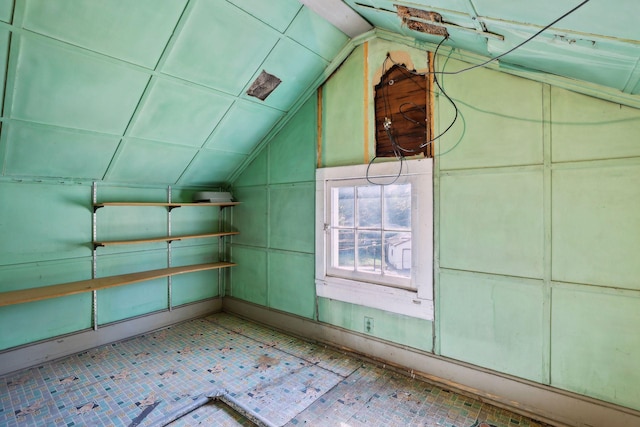 additional living space featuring vaulted ceiling