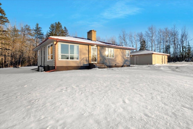 view of front of house with an outbuilding