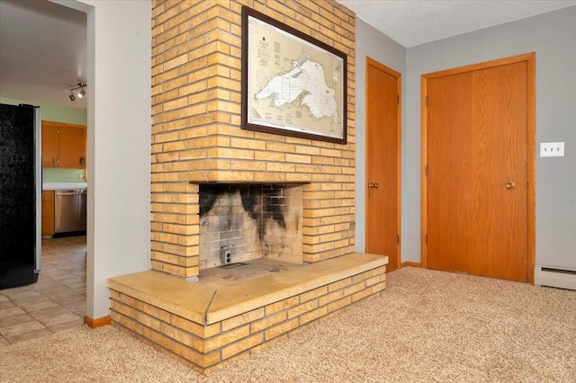 carpeted living room with a brick fireplace and a baseboard heating unit