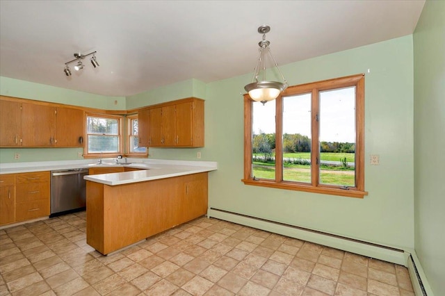 kitchen featuring dishwasher, a baseboard heating unit, pendant lighting, and kitchen peninsula