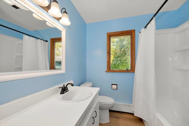 full bathroom with wood-type flooring, plenty of natural light, baseboard heating, and toilet