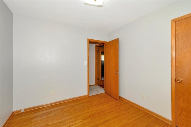 empty room with light hardwood / wood-style floors