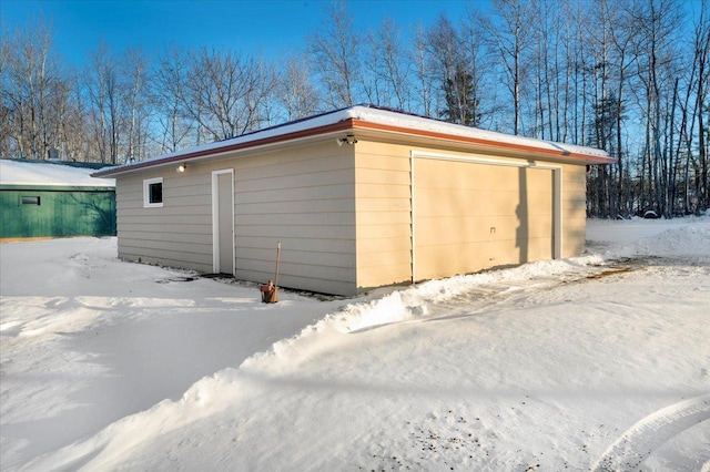 view of snow covered garage