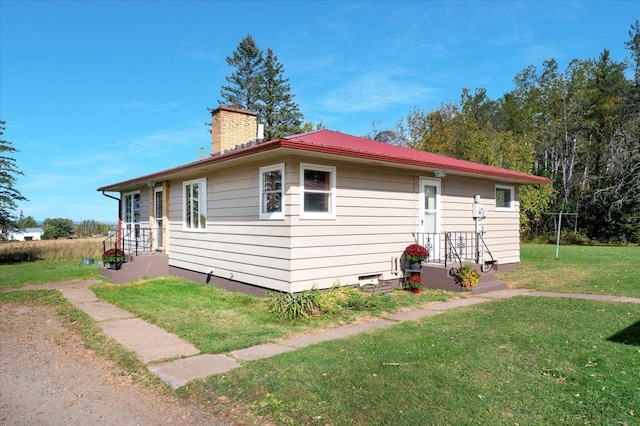 view of home's exterior with a yard