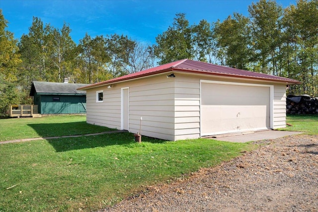 garage with a lawn