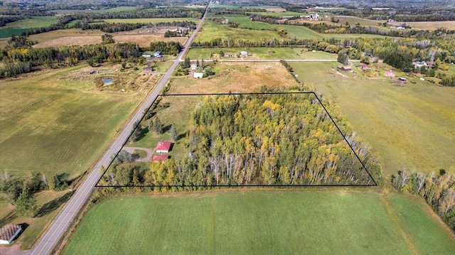 birds eye view of property featuring a rural view