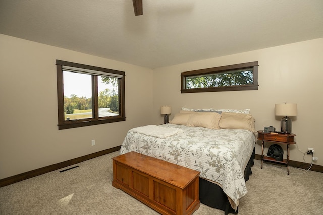 carpeted bedroom featuring ceiling fan