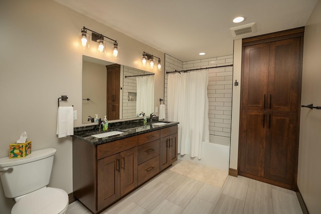 full bathroom featuring shower / bath combination with curtain, vanity, and toilet