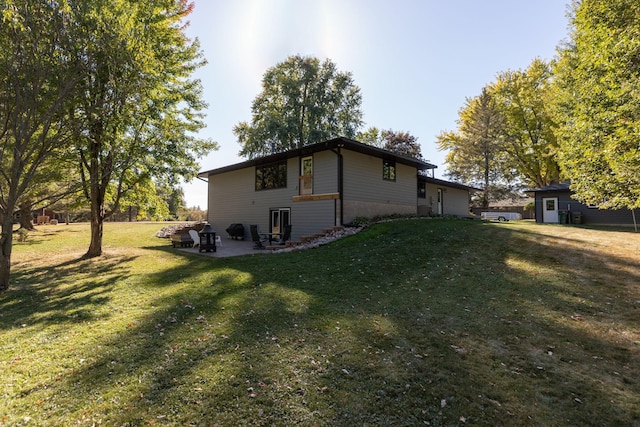 view of home's exterior with a lawn and a patio area