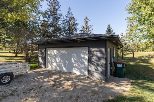 garage featuring a yard