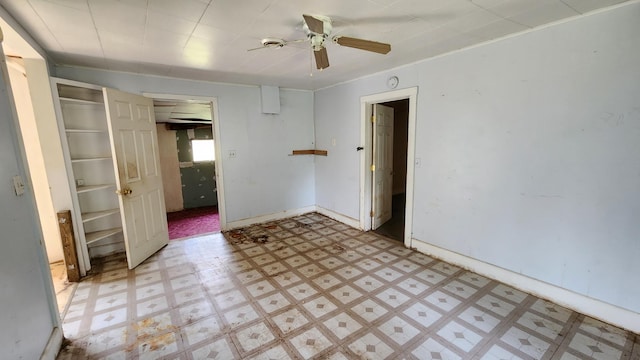 unfurnished room with ceiling fan